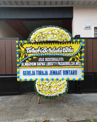 Papan Bunga Duka di Sikadamai